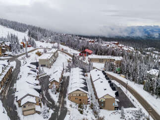 Nestled in a winter wonderland, this property offers stunning views and cozy living.