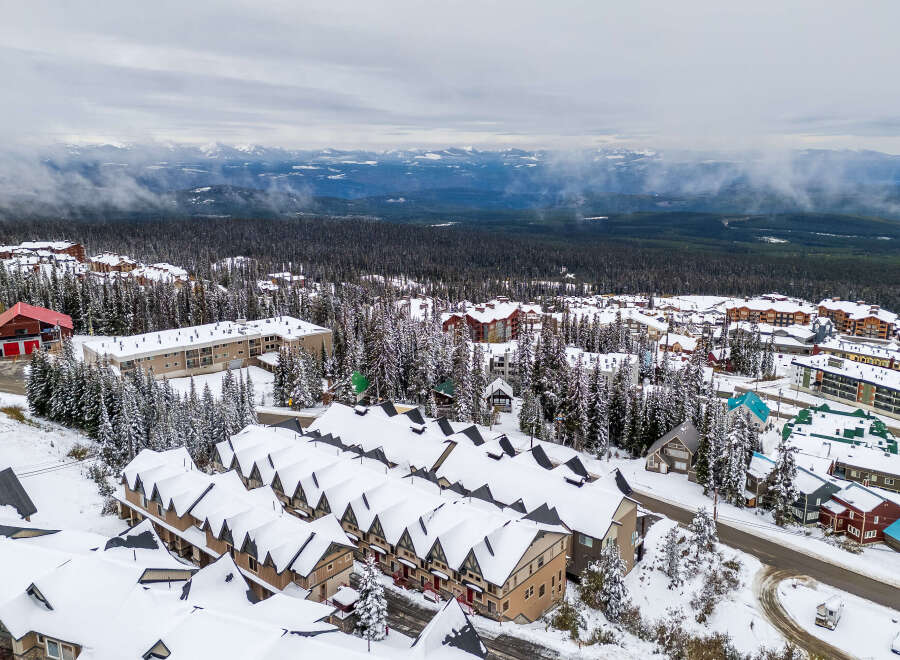 Discover a winter wonderland in this stunning mountain property! This home boasts cozy interiors, perfect for enjoying snowy days.