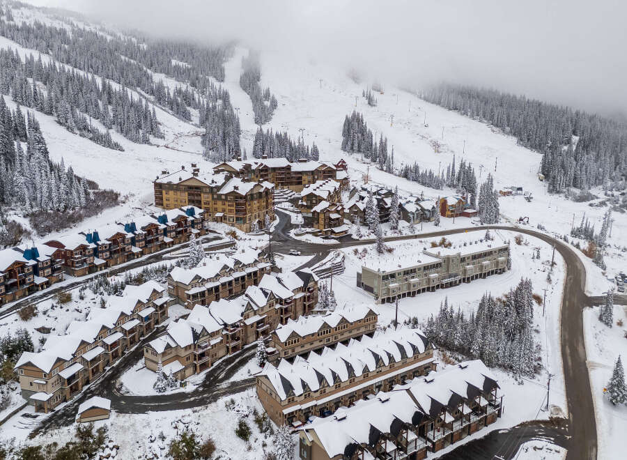 Nestled amidst a snowy mountain landscape, this property offers a serene retreat.