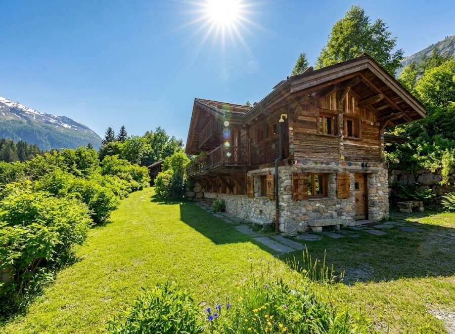 Nestled in a serene landscape, this charming wooden chalet offers a perfect blend of rustic elegance and modern comfort.