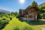 Nestled in a serene landscape, this charming wooden chalet offers a perfect blend of rustic elegance and modern comfort.