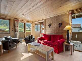 Experience the charm of this cozy chalet, featuring a warm wooden interior and stunning mountain views.