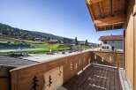 Enjoy breathtaking views from this charming balcony overlooking a picturesque village.