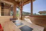 Enjoy breathtaking mountain views from this cozy cabin dining area.