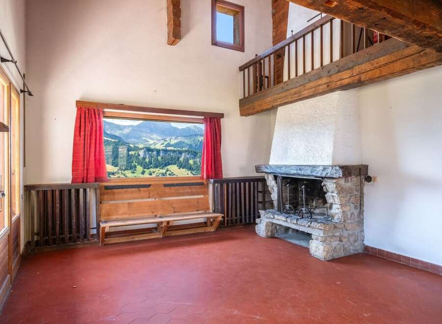 Experience the charm of this stunning property, featuring a cozy fireplace and a breathtaking mountain view.