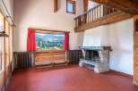 Experience the charm of this stunning property, featuring a cozy fireplace and a breathtaking mountain view.