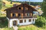 Discover the charm of this stunning wooden chalet nestled in a picturesque setting.