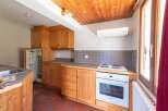 Discover this charming kitchen with its warm wooden cabinets and inviting atmosphere.