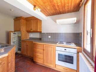 Discover this charming kitchen with its warm wooden cabinets and inviting atmosphere.
