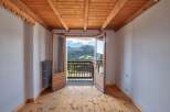 This charming property boasts stunning mountain views from its balcony, perfect for enjoying the fresh air and natural beauty.