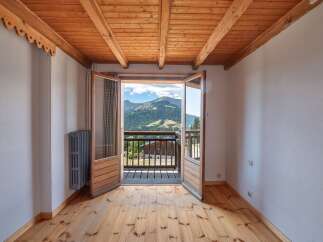 This charming property boasts stunning mountain views from its balcony, perfect for enjoying the fresh air and natural beauty.