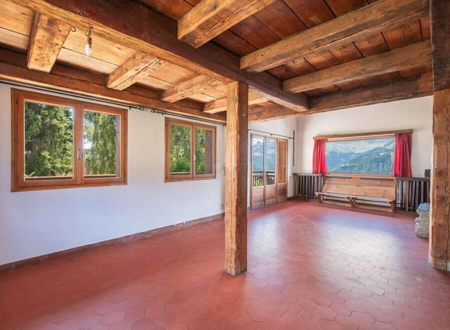 This stunning property boasts a rustic charm with its exposed wooden beams and warm, inviting atmosphere.