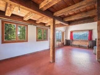 This stunning property boasts a rustic charm with its exposed wooden beams and warm, inviting atmosphere.
