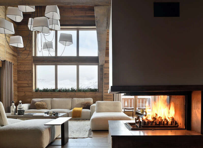 Experience the epitome of luxury living in this stunning property, featuring a cozy fireplace perfect for chilly evenings.