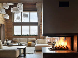 Experience the epitome of luxury living in this stunning property, featuring a cozy fireplace perfect for chilly evenings.