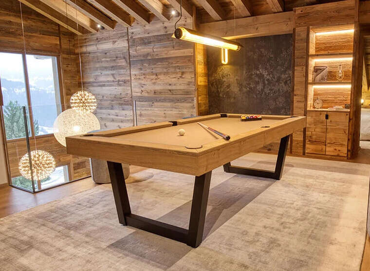 This luxurious property boasts a stunning billiards room, perfect for entertaining guests or enjoying a relaxing evening.