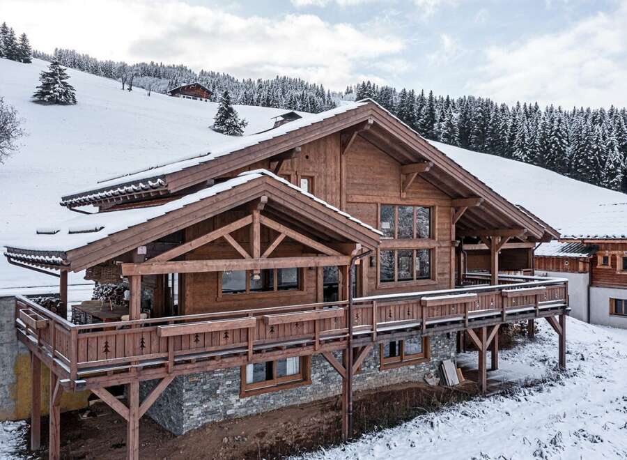 This stunning wooden chalet offers a perfect blend of rustic charm and modern luxury.
