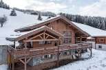 This stunning wooden chalet offers a perfect blend of rustic charm and modern luxury.