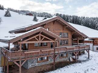 This stunning wooden chalet offers a perfect blend of rustic charm and modern luxury.