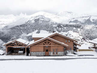 Experience the ultimate in luxury living with this stunning chalet nestled in the heart of the snowy mountains.