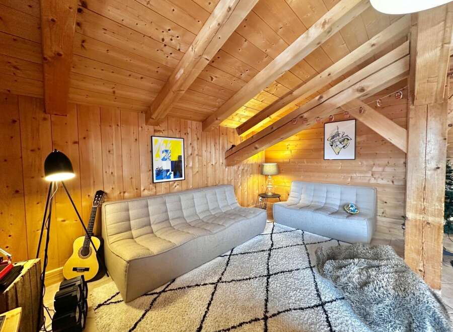 This cozy living space features a warm wooden interior, creating a welcoming atmosphere.