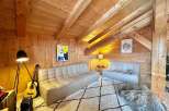 This cozy living space features a warm wooden interior, creating a welcoming atmosphere.