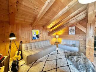 This cozy living space features a warm wooden interior, creating a welcoming atmosphere.
