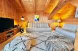 This cozy living space features a warm wooden interior, creating a welcoming atmosphere.