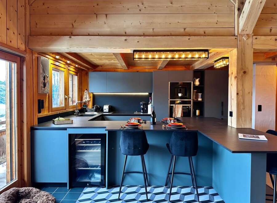 This stunning kitchen boasts a modern design with a touch of rustic charm, perfect for entertaining.