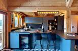This stunning kitchen boasts a modern design with a touch of rustic charm, perfect for entertaining.