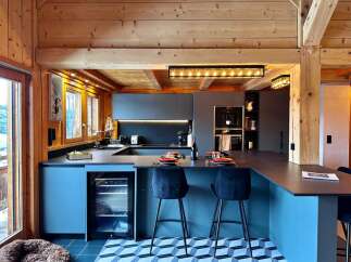 This stunning kitchen boasts a modern design with a touch of rustic charm, perfect for entertaining.