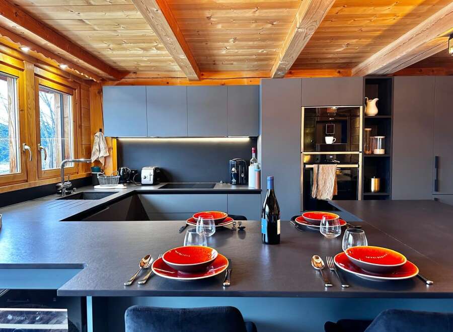 Experience luxury living in this stunning kitchen, featuring a modern design with sleek countertops and ample space for culinary creations.