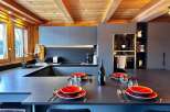 Experience luxury living in this stunning kitchen, featuring a modern design with sleek countertops and ample space for culinary creations.
