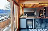 Experience luxury living in this stunning kitchen with breathtaking mountain views.