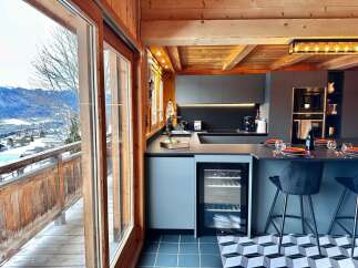 Experience luxury living in this stunning kitchen with breathtaking mountain views.