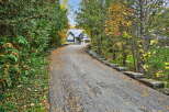 Discover your dream home nestled in a serene, tree-lined setting.
