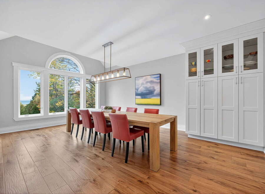 This stunning dining room boasts a modern design with a touch of elegance.