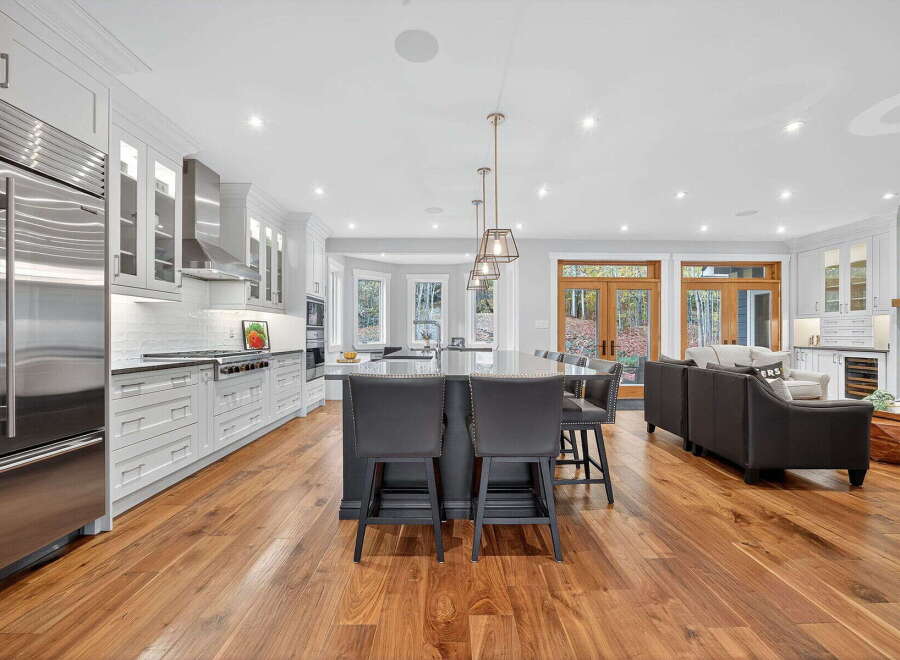 This stunning kitchen boasts a modern design with high-end appliances and ample counter space, perfect for culinary enthusiasts.