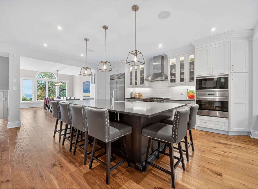 This stunning kitchen boasts a large island with seating, perfect for entertaining or casual dining.