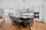 This stunning kitchen boasts a large island with seating, perfect for entertaining or casual dining.