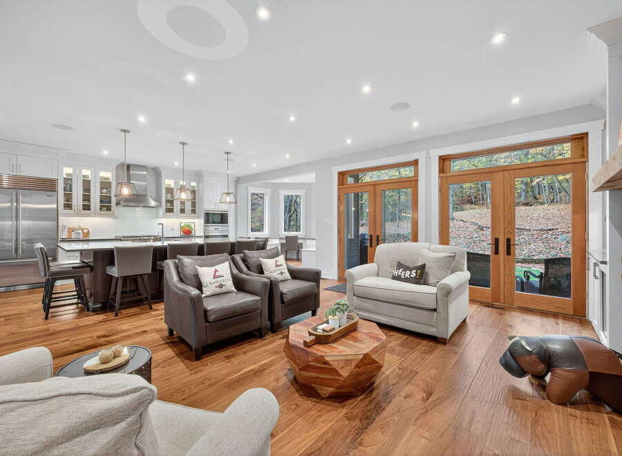 Step into luxury with this stunning open-concept living space! Featuring a gourmet kitchen, cozy seating areas, and expansive windows, this home is perfect for entertaining.
