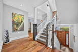 Step into luxury with this stunning property featuring a grand staircase and exquisite hardwood floors.