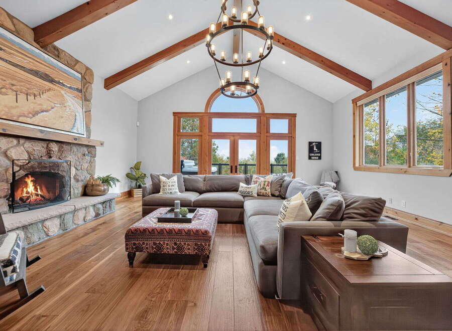 Experience luxury living in this stunning home featuring a cozy fireplace, perfect for chilly evenings.