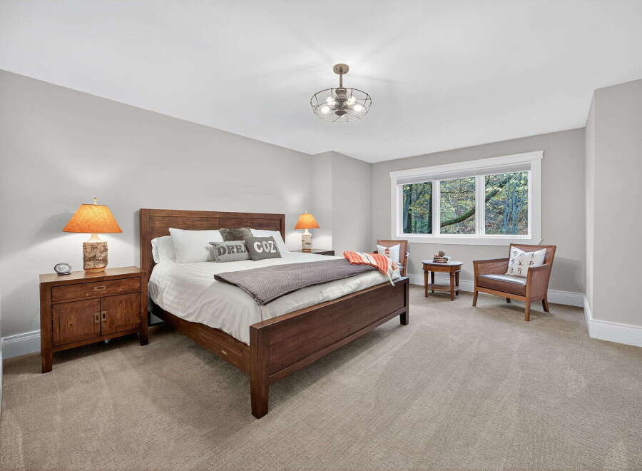 This inviting bedroom features a cozy atmosphere with a comfortable bed and stylish decor.