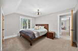 This inviting bedroom features a cozy atmosphere with a comfortable bed and a stylish nightstand.