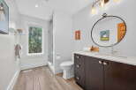 This stunning bathroom boasts a modern design with a touch of nature.