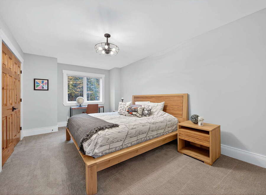 This inviting bedroom showcases a modern design with a touch of warmth.