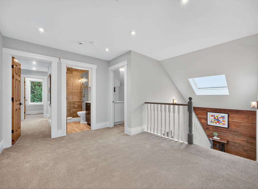 This stunning property features a beautifully designed hallway with access to multiple rooms.