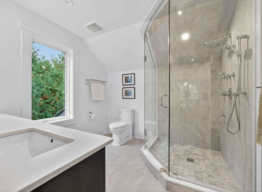 Step into luxury with this beautifully designed bathroom! Featuring a modern glass shower, sleek countertops, and a bright, airy atmosphere, this space is perfect for relaxation.
