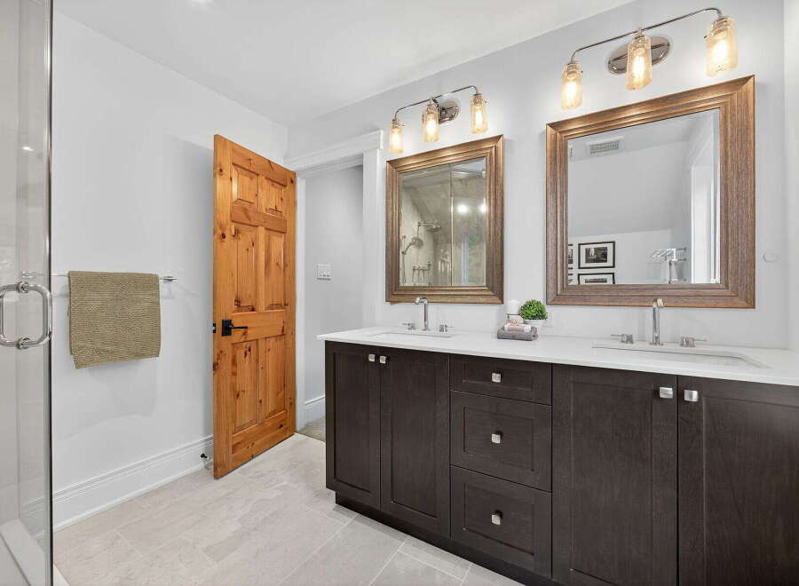This stunning bathroom features a modern design with a touch of rustic charm.